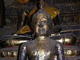 Bangkok 02 07 Lucky Buddha The tuk-tuk driver has to make some extra money somehow. Our next stop was one of those. We visited the so-called Lucky Buddha, supposedly only open one day a year, and this was our lucky day. This is really just an average temple. The caretaker was very friendly and had supposedly had visited Canada a few times. If we were looking for some of the famous Thai jewelry, he recommended a certain shop. We went there, and yes, we bought something. We were quite satisfied. He then took us to a suit shop, but we simply said no, and we were off again to finish our tour at Wat Saket. We paid the tuk-tuk driver his 100 Baht and gave him a tip of another 100 Baht. The tour was a lot of fun.